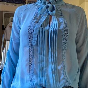 Sheer long sleeved top.